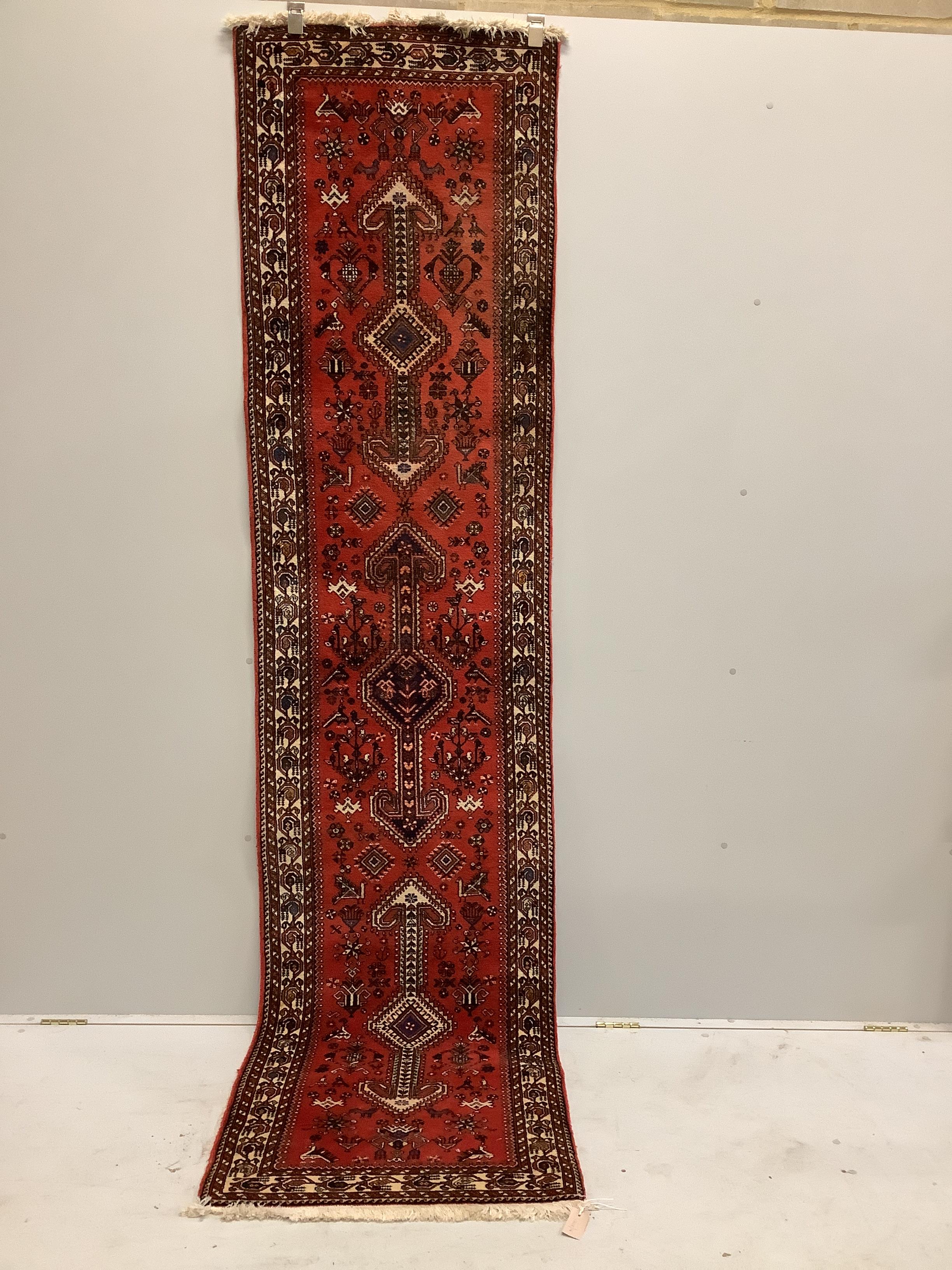 A North West Persian red ground runner, 300 x 72cm